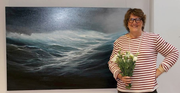 Artist with sea painting